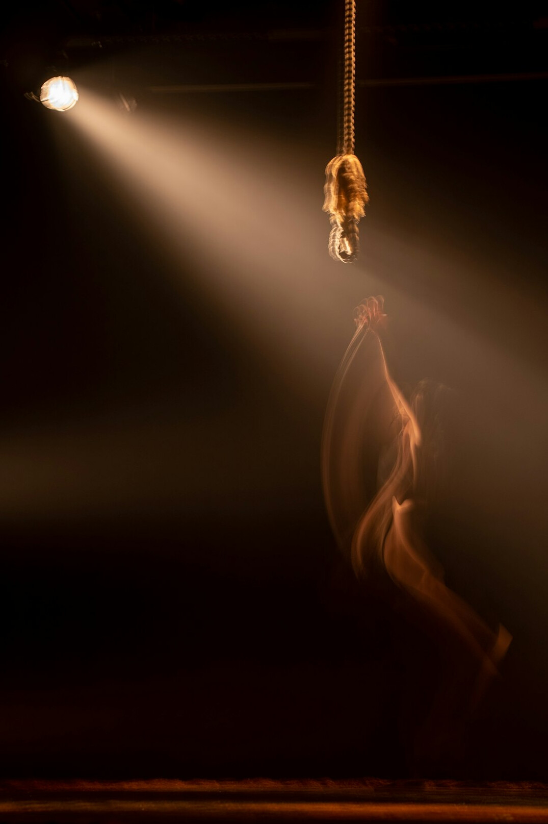 Spotlight on an empty theatre stage before a performance