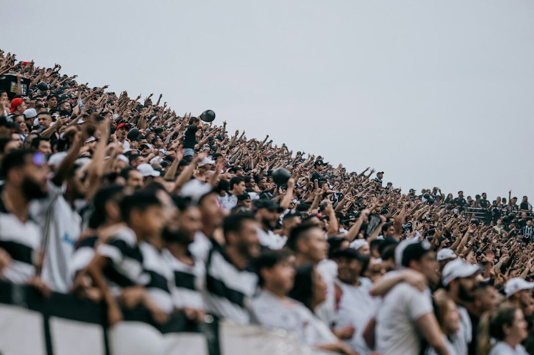 soccer fans cheering in stadium